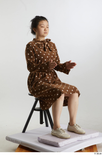 Aera  1 brown dots dress casual dressed sitting white…
